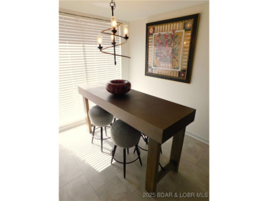 This ground-floor, 1-story, end unit enjoys easy access from the on Seasons Ridge At Four Seasons in Missouri - for sale on GolfHomes.com, golf home, golf lot