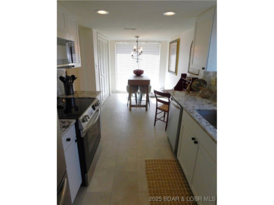 This ground-floor, 1-story, end unit enjoys easy access from the on Seasons Ridge At Four Seasons in Missouri - for sale on GolfHomes.com, golf home, golf lot