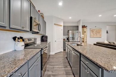 Welcome to this beautifully maintained coastal cottage located on Carolina National Golf Club in North Carolina - for sale on GolfHomes.com, golf home, golf lot