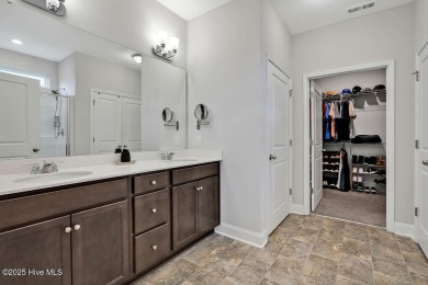 Welcome to this beautifully maintained coastal cottage located on Carolina National Golf Club in North Carolina - for sale on GolfHomes.com, golf home, golf lot