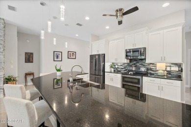 Experience a life of unparalleled luxury and serenity. This on Plantation Bay Golf and Country Club in Florida - for sale on GolfHomes.com, golf home, golf lot