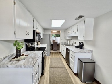 Looking for easy living in a central location with convenience on Hilaman Park Golf Course in Florida - for sale on GolfHomes.com, golf home, golf lot