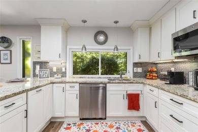 Welcome to this beautiful mid-century ranch-style house located on Rivermont Golf and Country Club in Georgia - for sale on GolfHomes.com, golf home, golf lot
