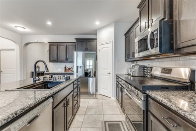 Welcome to this well-maintained 4-bedroom, 3.5-bath two-story on The Golf Club At Champions Circle in Texas - for sale on GolfHomes.com, golf home, golf lot