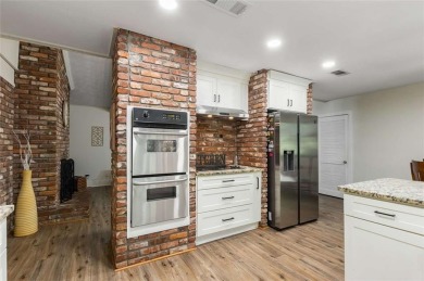 Welcome to this beautiful mid-century ranch-style house located on Rivermont Golf and Country Club in Georgia - for sale on GolfHomes.com, golf home, golf lot