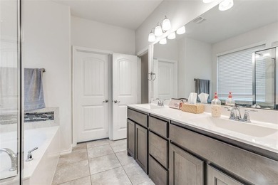 Welcome to this well-maintained 4-bedroom, 3.5-bath two-story on The Golf Club At Champions Circle in Texas - for sale on GolfHomes.com, golf home, golf lot