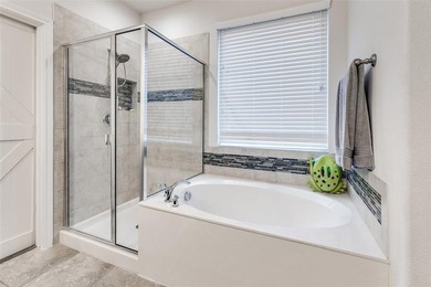 Welcome to this well-maintained 4-bedroom, 3.5-bath two-story on The Golf Club At Champions Circle in Texas - for sale on GolfHomes.com, golf home, golf lot