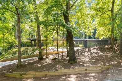 Welcome to this beautiful mid-century ranch-style house located on Rivermont Golf and Country Club in Georgia - for sale on GolfHomes.com, golf home, golf lot