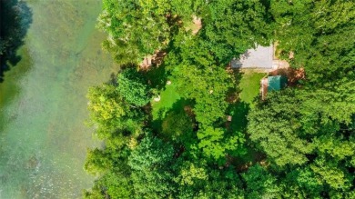 Welcome to this beautiful mid-century ranch-style house located on Rivermont Golf and Country Club in Georgia - for sale on GolfHomes.com, golf home, golf lot