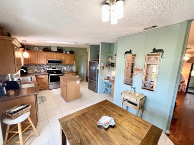 Move right into this furnished two-bedroom, two-bath home on Pine Lakes Country Club in Florida - for sale on GolfHomes.com, golf home, golf lot
