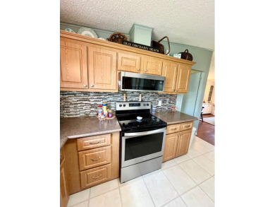 Move right into this furnished two-bedroom, two-bath home on Pine Lakes Country Club in Florida - for sale on GolfHomes.com, golf home, golf lot