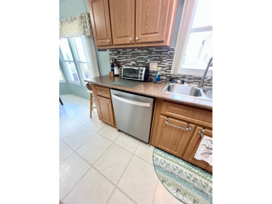 Move right into this furnished two-bedroom, two-bath home on Pine Lakes Country Club in Florida - for sale on GolfHomes.com, golf home, golf lot