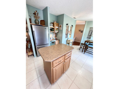 Move right into this furnished two-bedroom, two-bath home on Pine Lakes Country Club in Florida - for sale on GolfHomes.com, golf home, golf lot