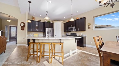 Welcome home to the heart of Redlands Mesa, where breathtaking on The Golf Club At Redlands Mesa in Colorado - for sale on GolfHomes.com, golf home, golf lot