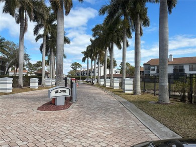 Luxury fully renovated 2BR/2BA golf course and lake view condo on Feather Sound Country Club in Florida - for sale on GolfHomes.com, golf home, golf lot