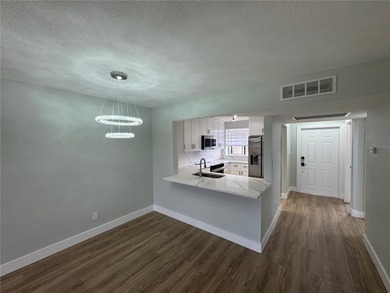 Luxury fully renovated 2BR/2BA golf course and lake view condo on Feather Sound Country Club in Florida - for sale on GolfHomes.com, golf home, golf lot