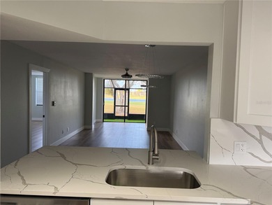 Luxury fully renovated 2BR/2BA golf course and lake view condo on Feather Sound Country Club in Florida - for sale on GolfHomes.com, golf home, golf lot