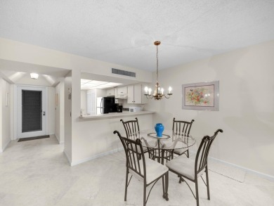 Very Rare Waterfront 1st Floor Condo: Enjoy the peaceful on PGA National Golf Club in Florida - for sale on GolfHomes.com, golf home, golf lot