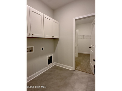 This stunning new 4-bedroom, 2.5-bath home in the gated Woodlake on Woodlake Country Club in North Carolina - for sale on GolfHomes.com, golf home, golf lot