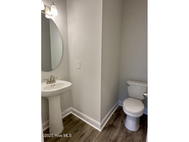 This stunning new 4-bedroom, 2.5-bath home in the gated Woodlake on Woodlake Country Club in North Carolina - for sale on GolfHomes.com, golf home, golf lot