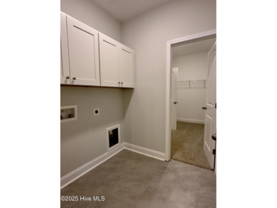 This stunning new 4-bedroom, 2.5-bath home in the gated Woodlake on Woodlake Country Club in North Carolina - for sale on GolfHomes.com, golf home, golf lot