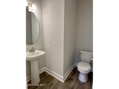 This stunning new 4-bedroom, 2.5-bath home in the gated Woodlake on Woodlake Country Club in North Carolina - for sale on GolfHomes.com, golf home, golf lot