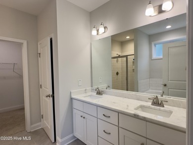 This stunning new 4-bedroom, 2.5-bath home in the gated Woodlake on Woodlake Country Club in North Carolina - for sale on GolfHomes.com, golf home, golf lot