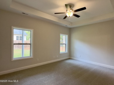 This stunning new 4-bedroom, 2.5-bath home in the gated Woodlake on Woodlake Country Club in North Carolina - for sale on GolfHomes.com, golf home, golf lot