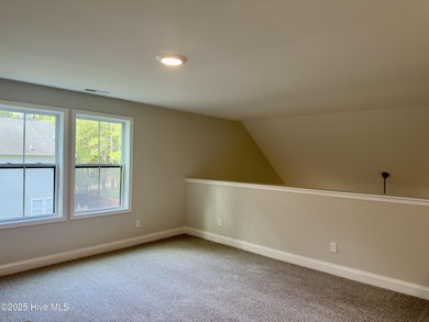 This stunning new 4-bedroom, 2.5-bath home in the gated Woodlake on Woodlake Country Club in North Carolina - for sale on GolfHomes.com, golf home, golf lot