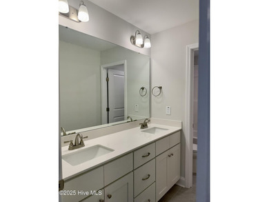 This stunning new 4-bedroom, 2.5-bath home in the gated Woodlake on Woodlake Country Club in North Carolina - for sale on GolfHomes.com, golf home, golf lot