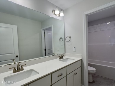 This stunning new 4-bedroom, 2.5-bath home in the gated Woodlake on Woodlake Country Club in North Carolina - for sale on GolfHomes.com, golf home, golf lot