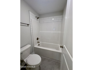 This stunning new 4-bedroom, 2.5-bath home in the gated Woodlake on Woodlake Country Club in North Carolina - for sale on GolfHomes.com, golf home, golf lot