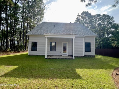 This stunning new 4-bedroom, 2.5-bath home in the gated Woodlake on Woodlake Country Club in North Carolina - for sale on GolfHomes.com, golf home, golf lot