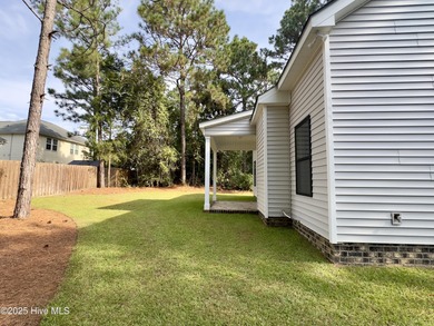 This stunning new 4-bedroom, 2.5-bath home in the gated Woodlake on Woodlake Country Club in North Carolina - for sale on GolfHomes.com, golf home, golf lot
