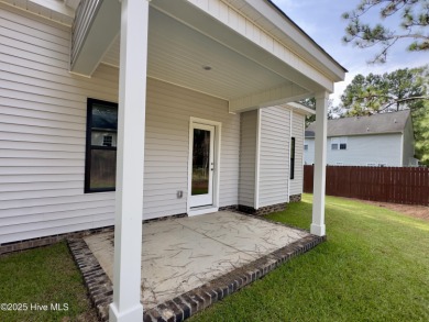 This stunning new 4-bedroom, 2.5-bath home in the gated Woodlake on Woodlake Country Club in North Carolina - for sale on GolfHomes.com, golf home, golf lot