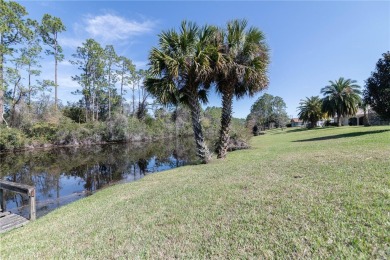 Beautiful, move in a ready canal home in the highly desirable on The Grand Club - Pine Lakes Course in Florida - for sale on GolfHomes.com, golf home, golf lot