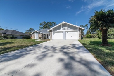 Beautiful, move in a ready canal home in the highly desirable on The Grand Club - Pine Lakes Course in Florida - for sale on GolfHomes.com, golf home, golf lot