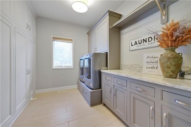 Welcome to this exquisite 1.5-story residence in the prestigious on Loch Lloyd Country Club in Missouri - for sale on GolfHomes.com, golf home, golf lot