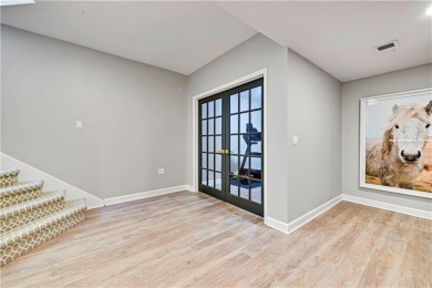 Welcome to this exquisite 1.5-story residence in the prestigious on Loch Lloyd Country Club in Missouri - for sale on GolfHomes.com, golf home, golf lot