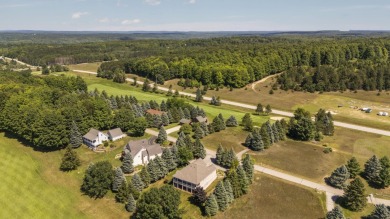 Welcome to your dream retreat at 5668 Golf Meadows Drive in on Shanty Creek Golf Course in Michigan - for sale on GolfHomes.com, golf home, golf lot