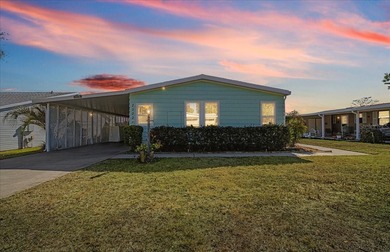 Wake up every day to peaceful water views and easy Florida on Plantation Golf Club in Florida - for sale on GolfHomes.com, golf home, golf lot