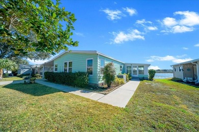 Wake up every day to peaceful water views and easy Florida on Plantation Golf Club in Florida - for sale on GolfHomes.com, golf home, golf lot