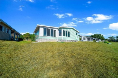 Wake up every day to peaceful water views and easy Florida on Plantation Golf Club in Florida - for sale on GolfHomes.com, golf home, golf lot