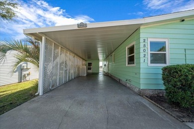 Wake up every day to peaceful water views and easy Florida on Plantation Golf Club in Florida - for sale on GolfHomes.com, golf home, golf lot