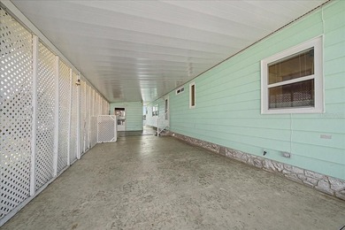 Wake up every day to peaceful water views and easy Florida on Plantation Golf Club in Florida - for sale on GolfHomes.com, golf home, golf lot