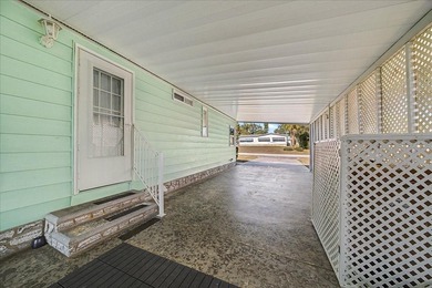 Wake up every day to peaceful water views and easy Florida on Plantation Golf Club in Florida - for sale on GolfHomes.com, golf home, golf lot