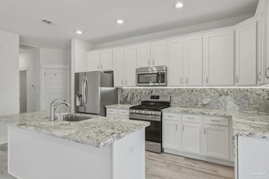 Built in 2021 and thoughtfully elevated beyond standard builds on Champion Golf Club in Florida - for sale on GolfHomes.com, golf home, golf lot