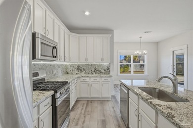 Built in 2021 and thoughtfully elevated beyond standard builds on Champion Golf Club in Florida - for sale on GolfHomes.com, golf home, golf lot