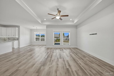 Built in 2021 and thoughtfully elevated beyond standard builds on Champion Golf Club in Florida - for sale on GolfHomes.com, golf home, golf lot