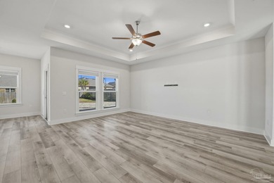 Built in 2021 and thoughtfully elevated beyond standard builds on Champion Golf Club in Florida - for sale on GolfHomes.com, golf home, golf lot